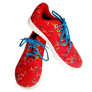 NOBULL Red Sneakers with Blue and Yellow Accents